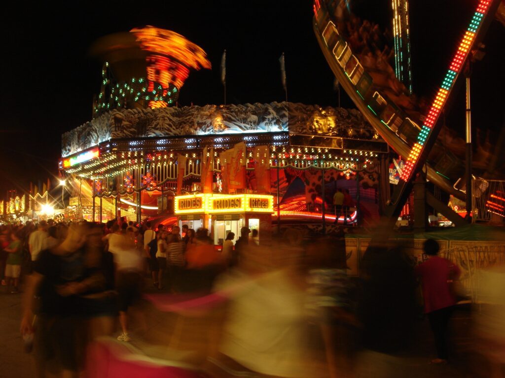night-time midway scenes with blurred lights; decorative